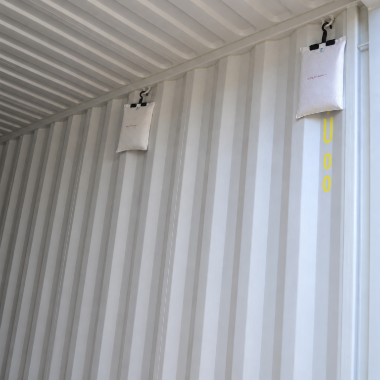Hanging ES K desiccant bags installed on the wall of a shipping container